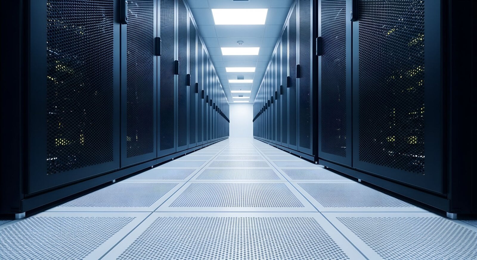 Data center aisle lined with server and switch racks on a raised floor